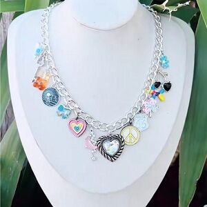 New. Never worn. Handmade Silver Charm Necklace with Colorful Accents